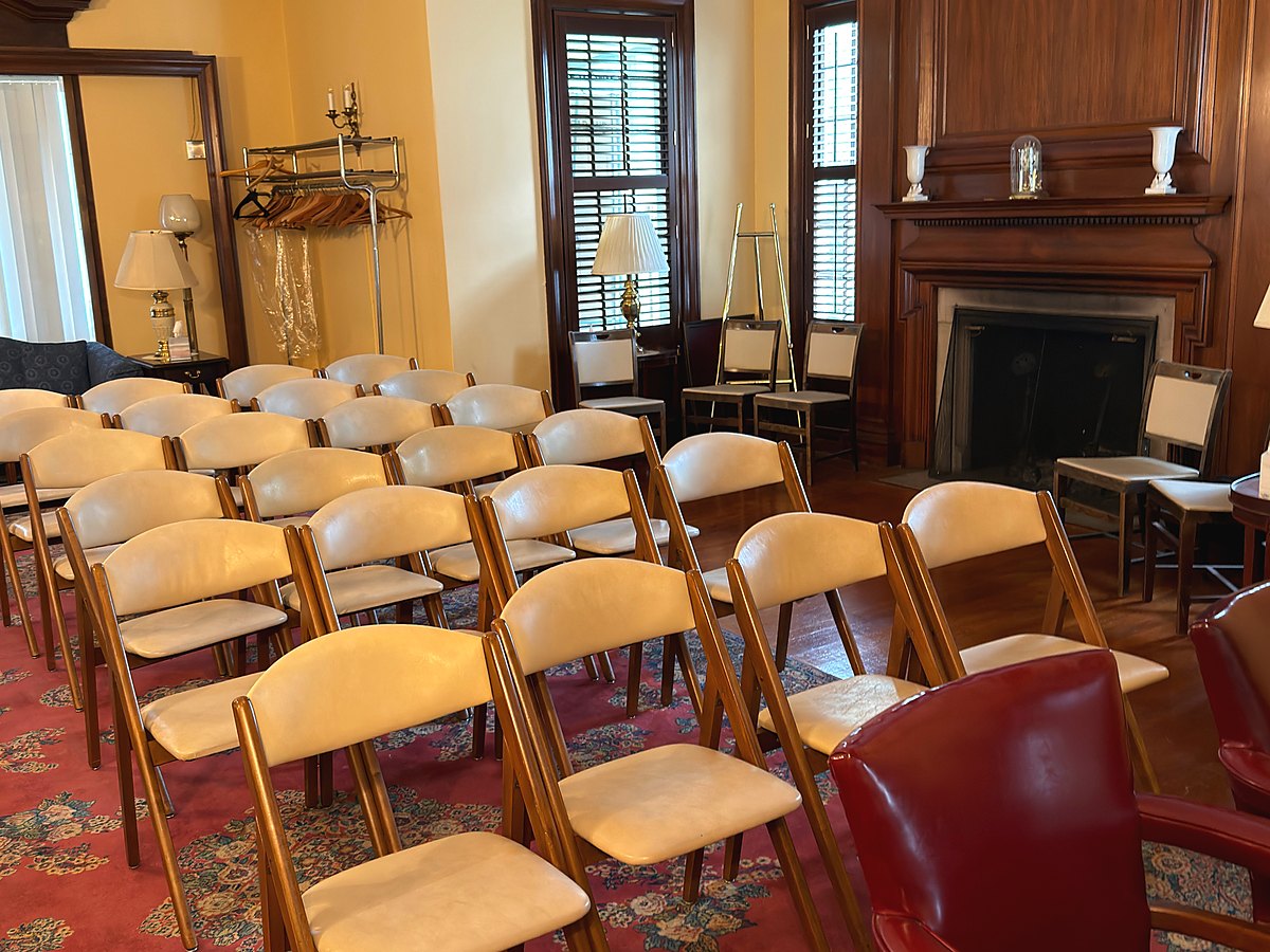 Our chapel, with rows of seating and the fireplace